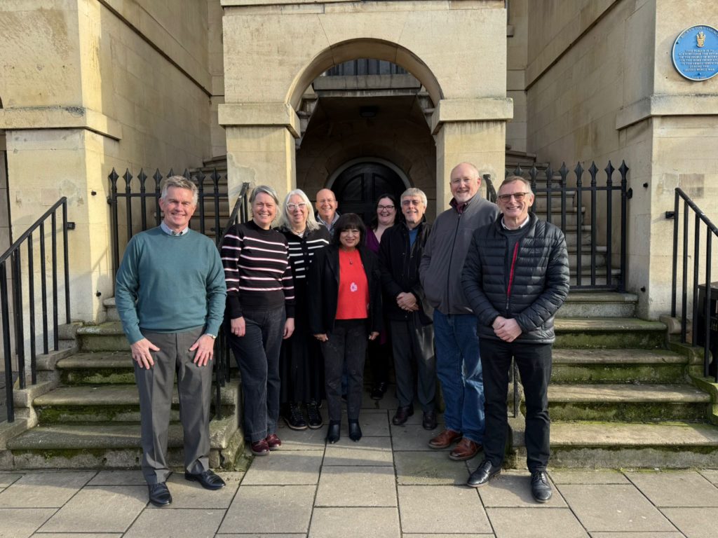 People gather outside The Old Town Hall in Bourne